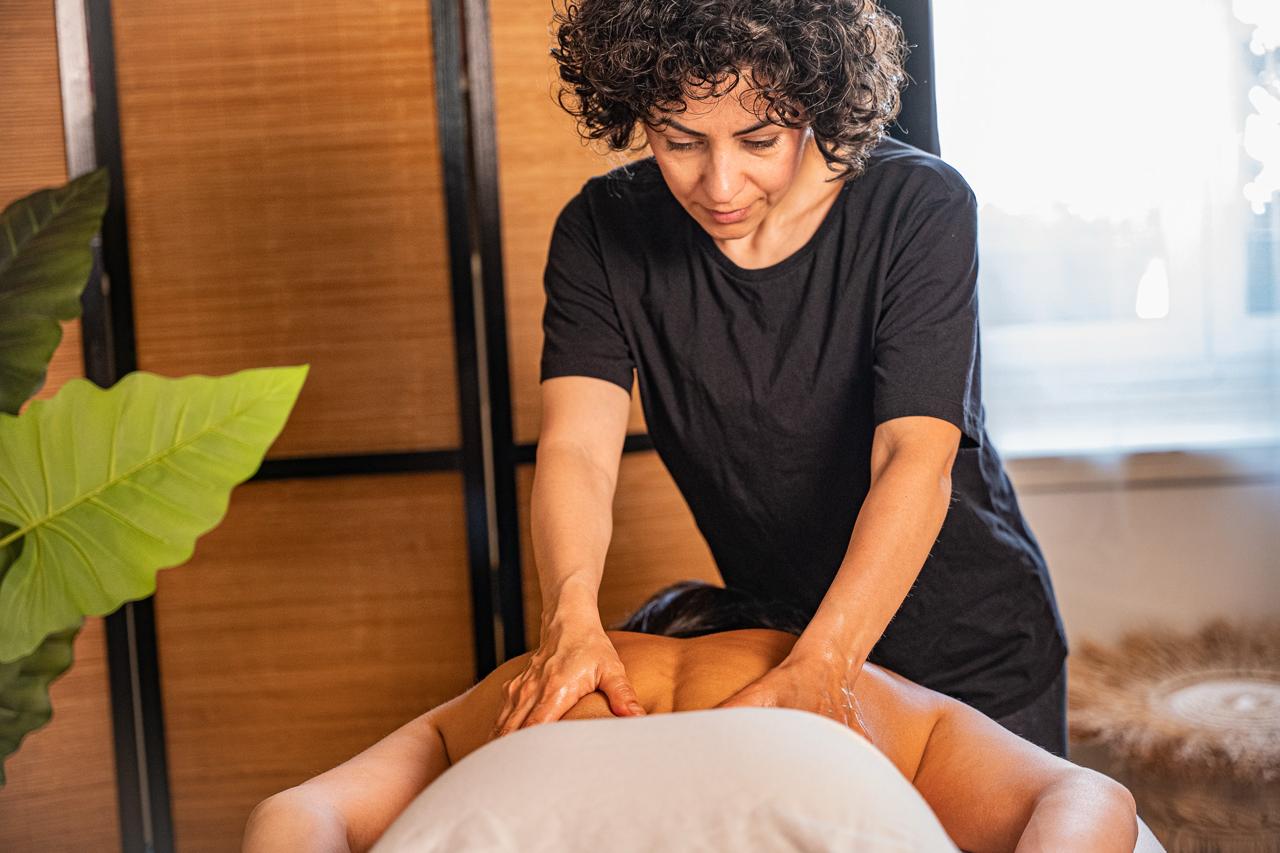 Sogol performing a deep-tissue massage